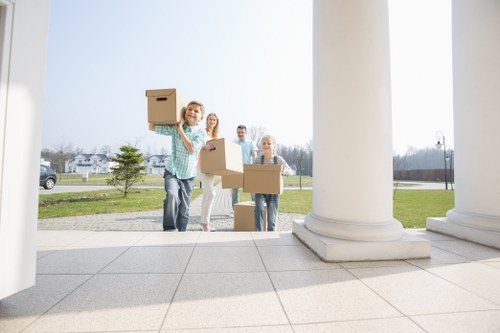 Professional local removals in Burroughs with moving van and packed boxes