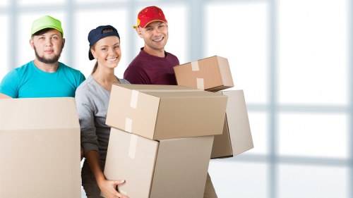 Moving crew loading furniture during removals and storage service